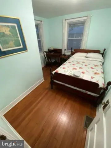 a bedroom with a bed and balcony