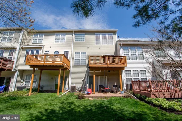 a view of a brick building with a yard
