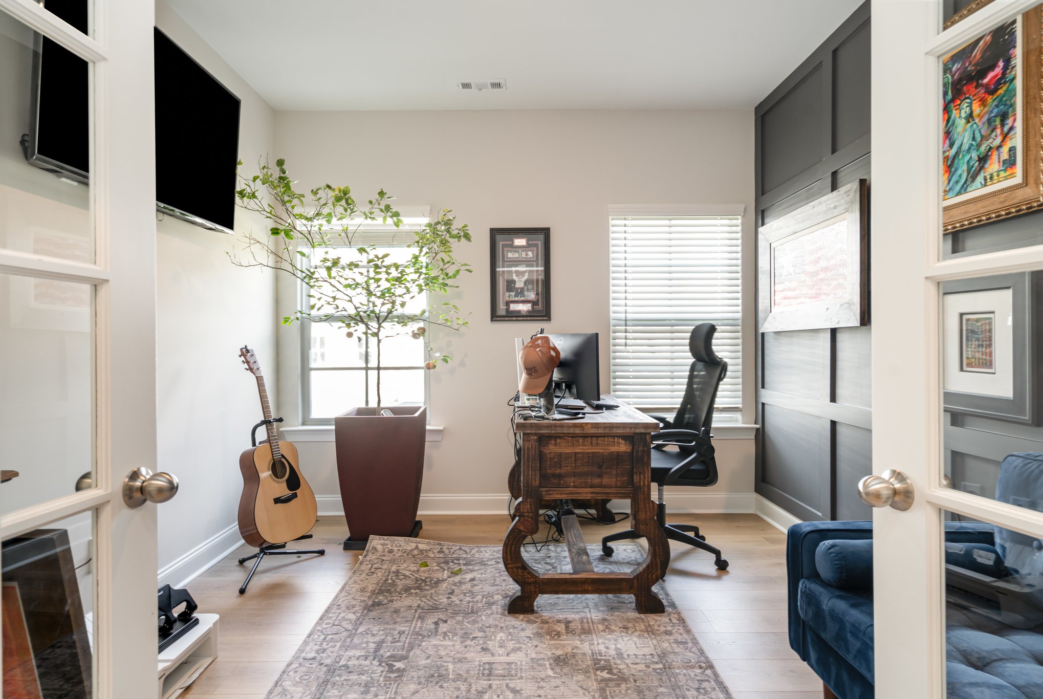 7445 Swindon Boulevard Fairview, TN 37062 - Photo 12 of 38 a living room with furniture a flat screen tv and a floor to ceiling window