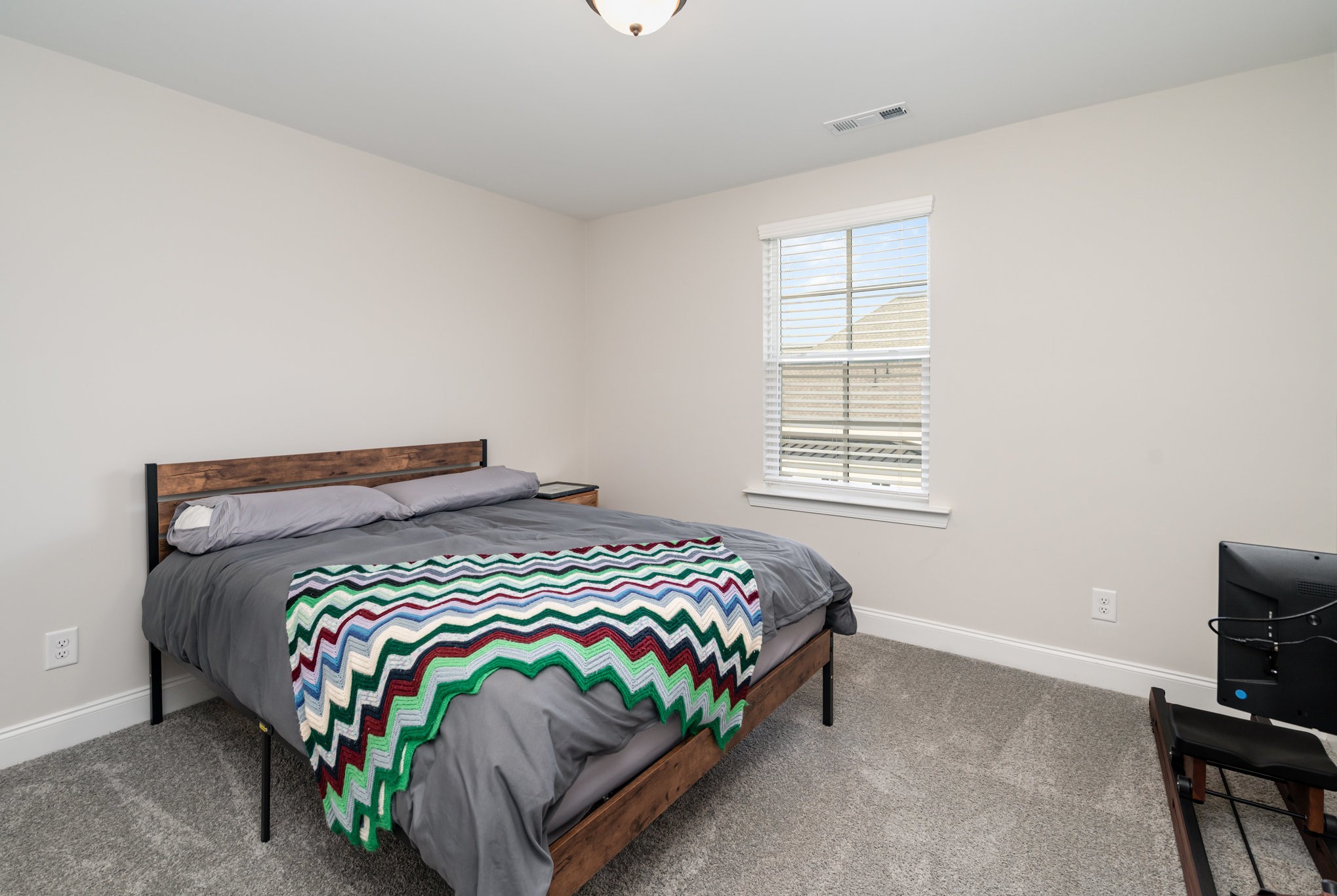 7445 Swindon Boulevard Fairview, TN 37062 - Photo 18 of 38 a bedroom with a bed and a window