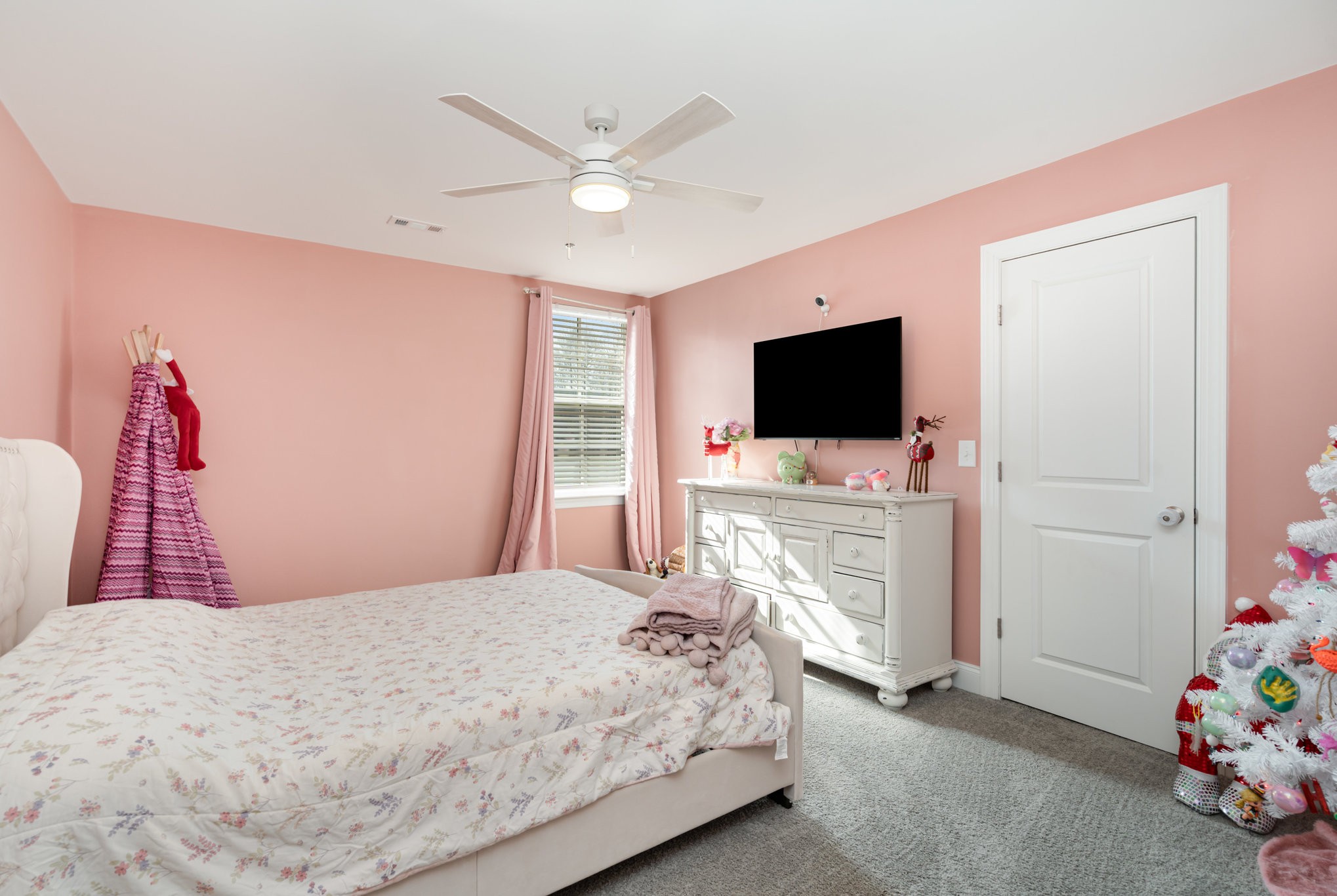 7445 Swindon Boulevard Fairview, TN 37062 - Photo 19 of 38 a bedroom with a bed and a flat screen tv