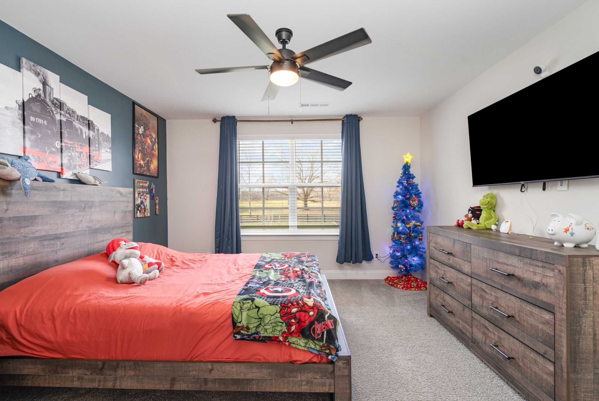 7445 Swindon Boulevard Fairview, TN 37062 - Photo 20 of 38 a bedroom with a bed and flat screen tv