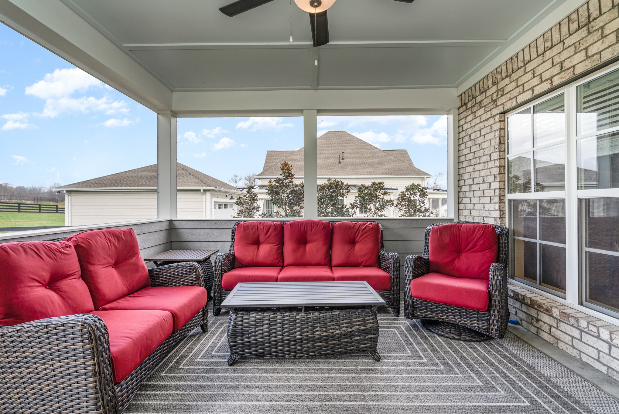 7445 Swindon Boulevard Fairview, TN 37062 - Photo 29 of 38 a living room with furniture a red lamp and a large window