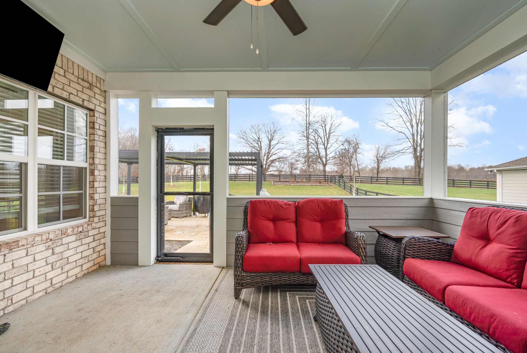 7445 Swindon Boulevard Fairview, TN 37062 - Photo 30 of 38 a living room with furniture and a floor to ceiling window