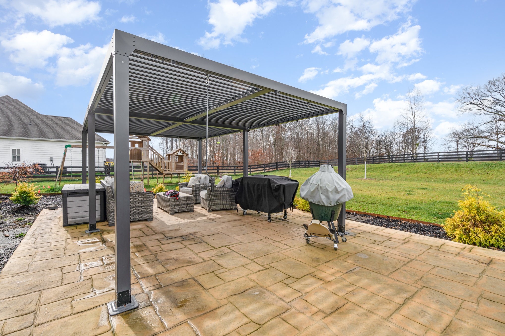 7445 Swindon Boulevard Fairview, TN 37062 - Photo 31 of 38 a view of a backyard with sitting area and furniture