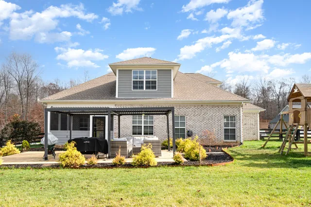 a front view of house with yard and seating area