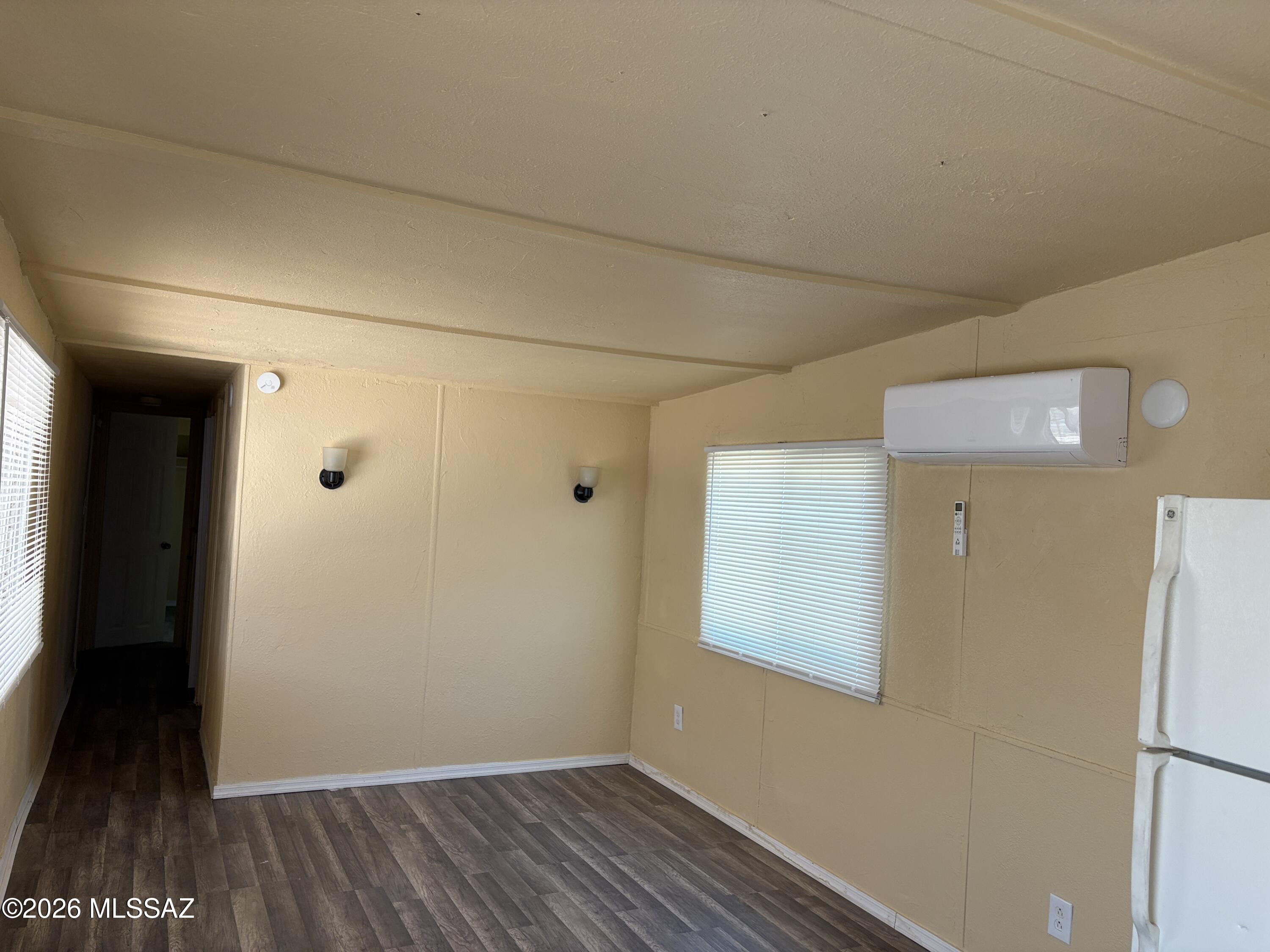1741 West Wetmore Road, Unit 29 Tucson, AZ 85705 - Photo 4 of 10 a view of a hallway with wooden floor