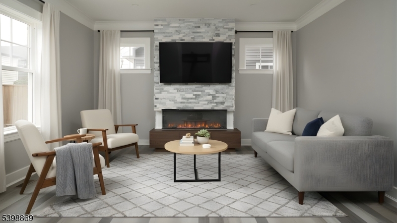 65 Poe Avenue Newark, NJ 07106 - Photo 13 of 18 a living room with furniture a fireplace and a flat screen tv