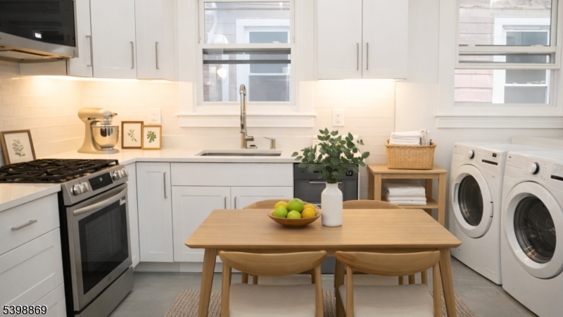 65 Poe Avenue Newark, NJ 07106 - Photo 8 of 18 a kitchen with a table chairs and a stove top oven