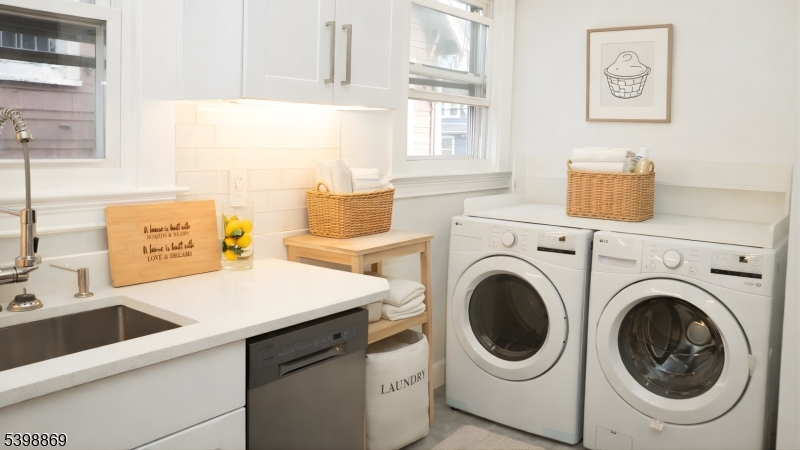 65 Poe Avenue Newark, NJ 07106 - Photo 9 of 18 a utility room with sink dryer and washer