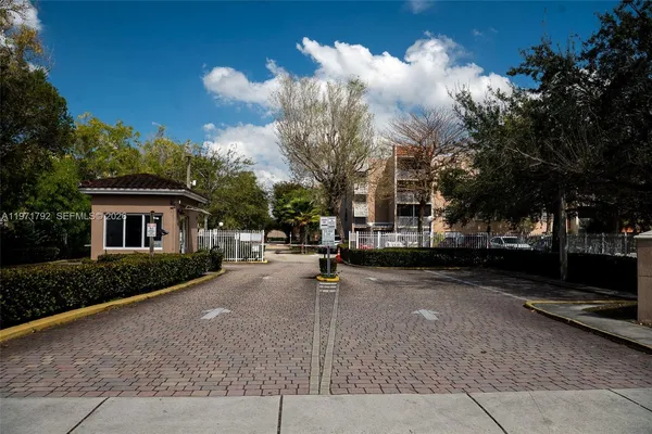 a view of a street with houses on both side