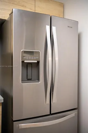 a view of a refrigerator in kitchen