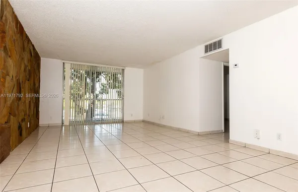 a view of an empty room and window