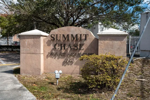 a view of a back yard of the house and a fountain