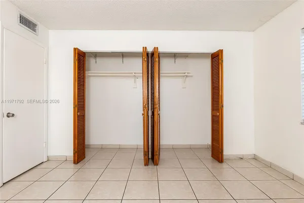 an empty room with closet