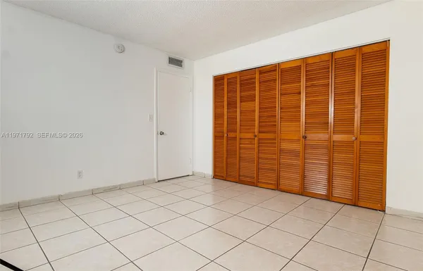a view of empty room with windows