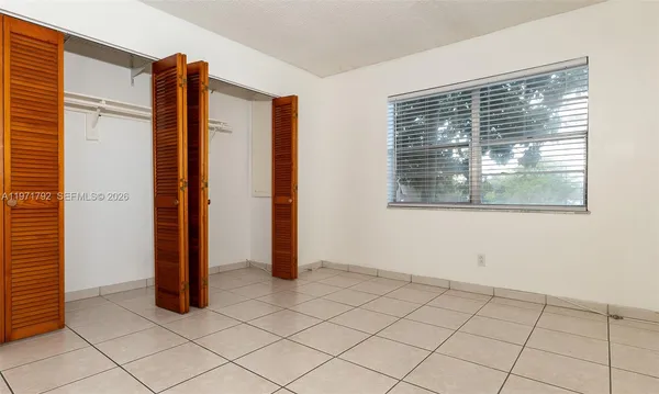 a bathroom with a glass door shower