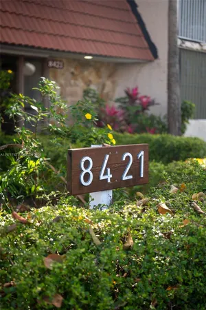 a potted plant sitting in front of a house