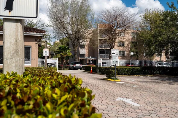 a view of a building with a yard