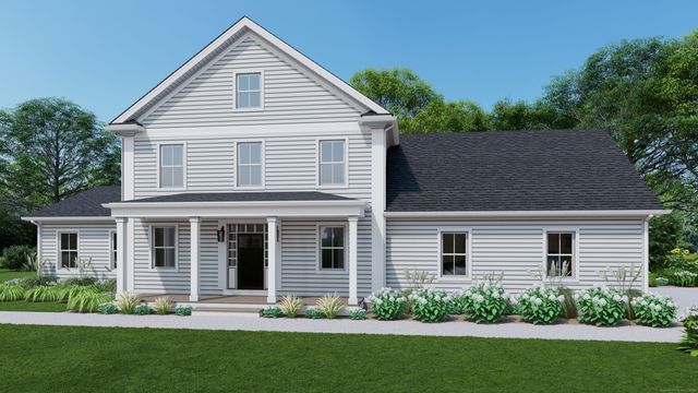 a front view of a house with a garden and plants