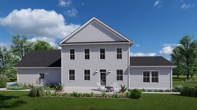 a front view of a house with a garden and plants