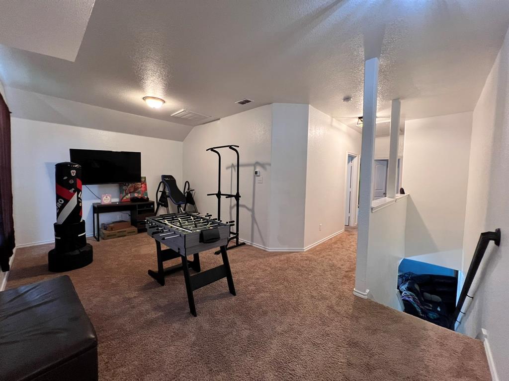324 Fairgrounds Lane Ponder, TX 76259 - Photo 31 of 40 a view of a room with gym equipment