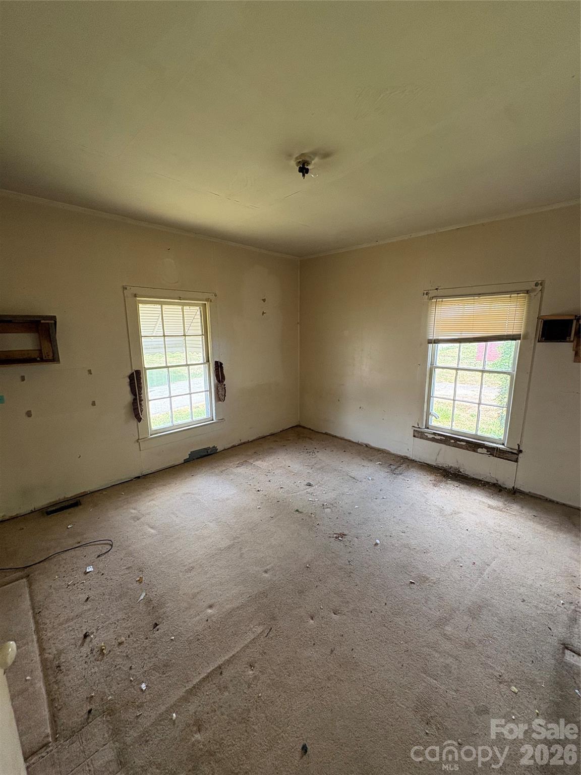 113 Davie Street Cooleemee, NC 27014 - Photo 11 of 14 an empty room with windows