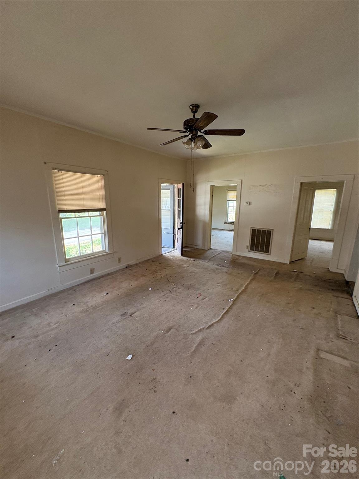 113 Davie Street Cooleemee, NC 27014 - Photo 12 of 14 a view of a livingroom with a ceiling fan and window