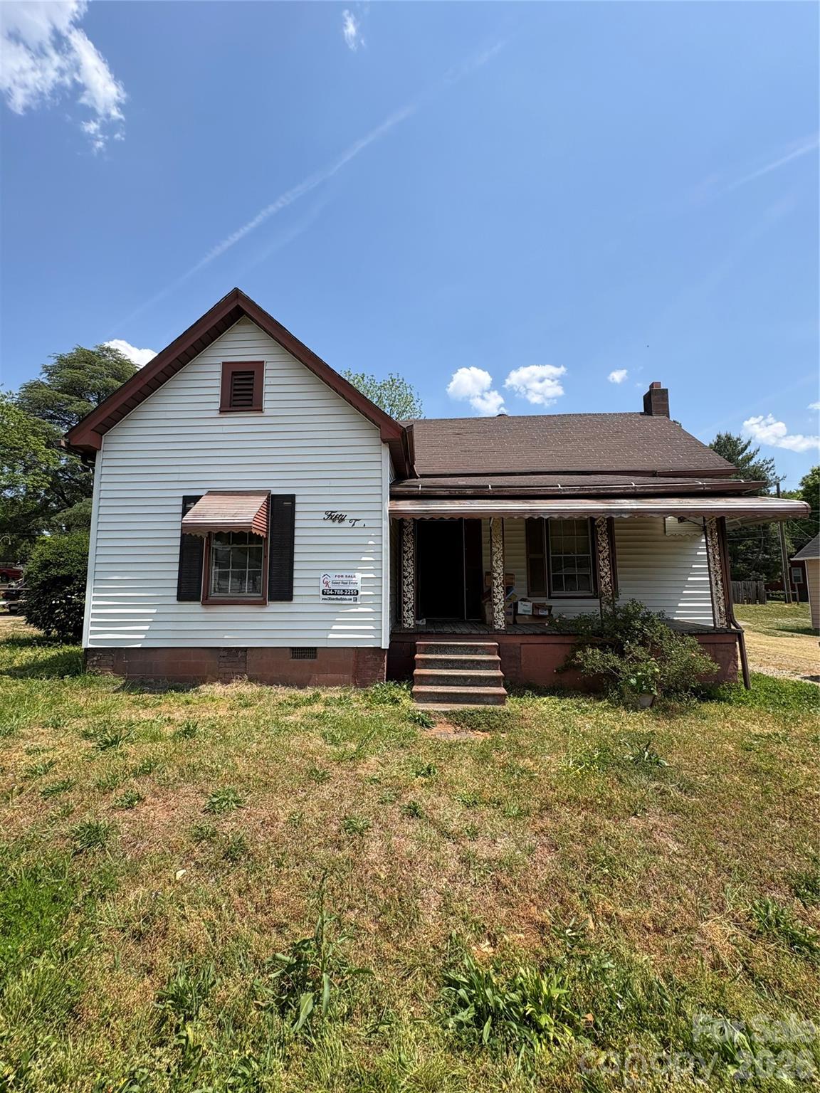113 Davie Street Cooleemee, NC 27014 - Photo 2 of 14 a front view of a house with a yard