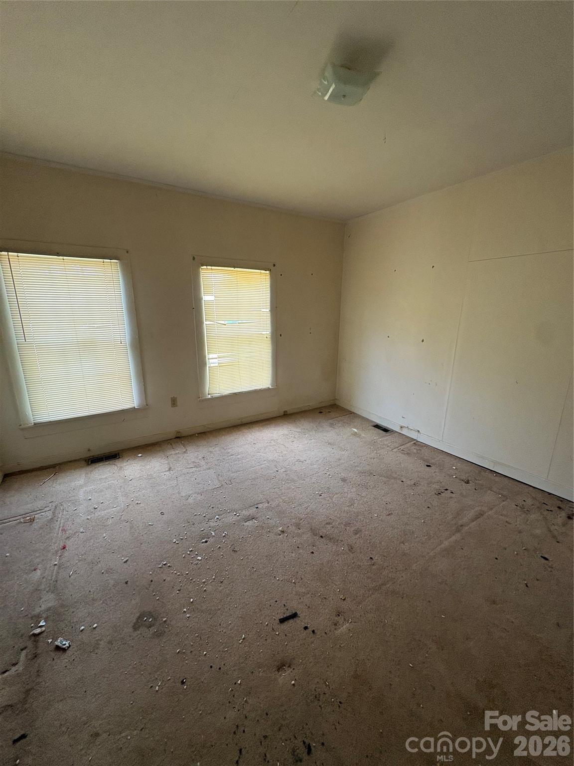 113 Davie Street Cooleemee, NC 27014 - Photo 8 of 14 an empty room with a window