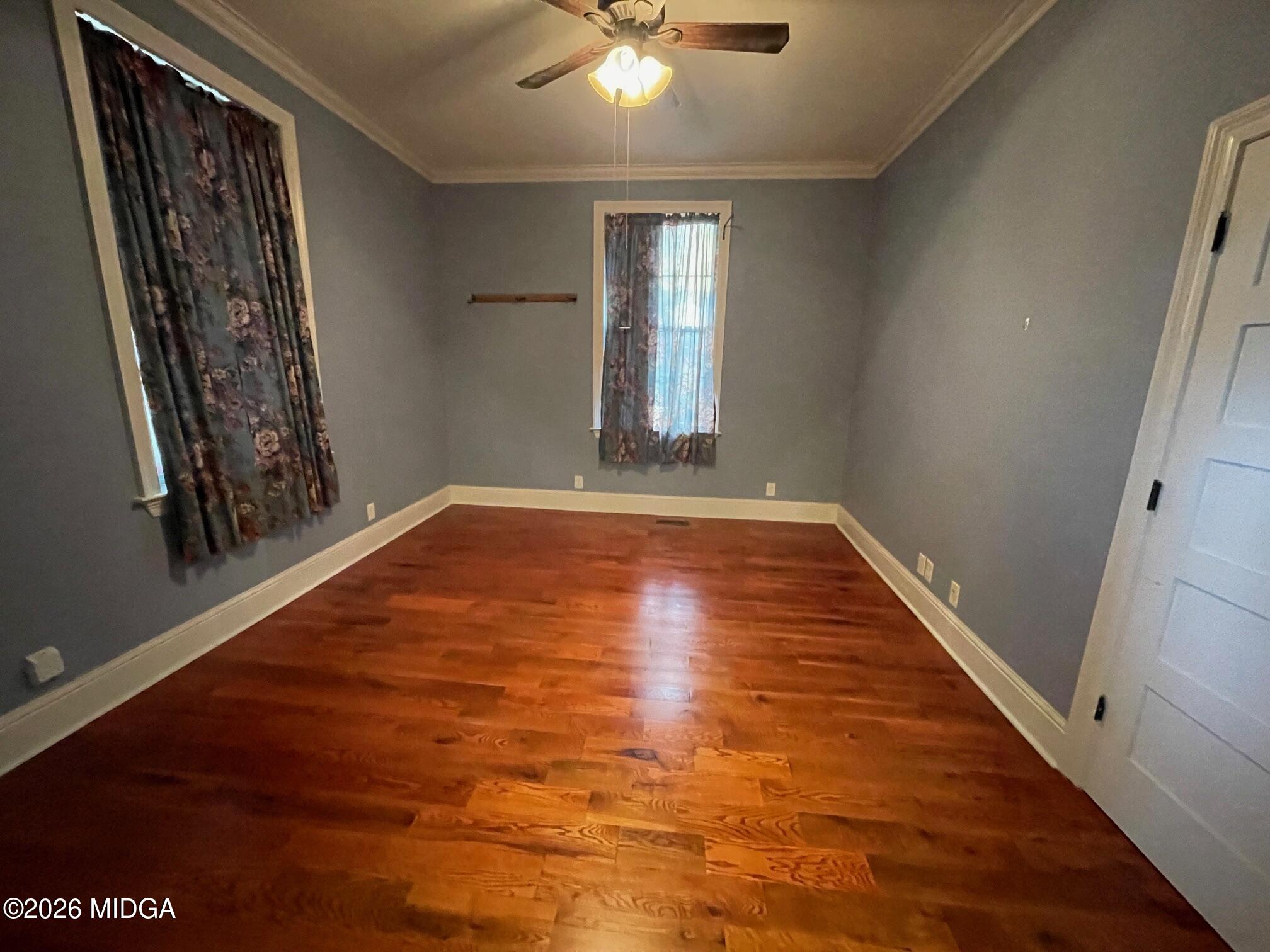 988 New Street Macon, GA 31201 - Photo 7 of 9 a view of an empty room with window and wooden floor