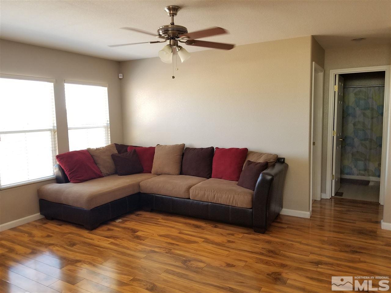 7505 Appenzell Street Reno, NV 89506 - Photo 5 of 18 a living room with furniture and a ceiling fan