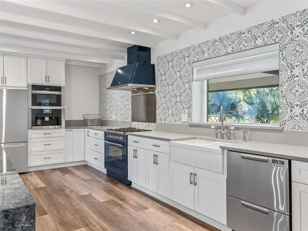a view of kitchen with furniture and large window