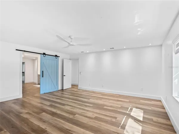 a view of an empty room with a window