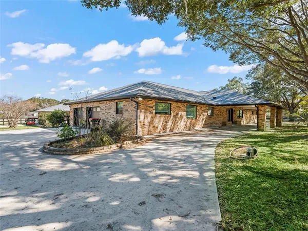 a kitchen with stainless steel appliances granite countertop a stove and cabinets