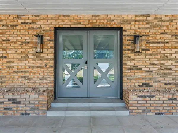 a kitchen with granite countertop a sink stainless steel appliances and cabinets