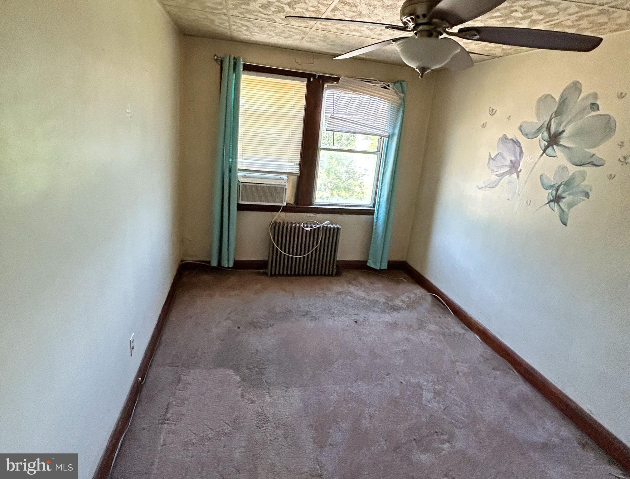 4014 Century Road Baltimore, MD 21206 - Photo 14 of 19 an empty room with windows and fan