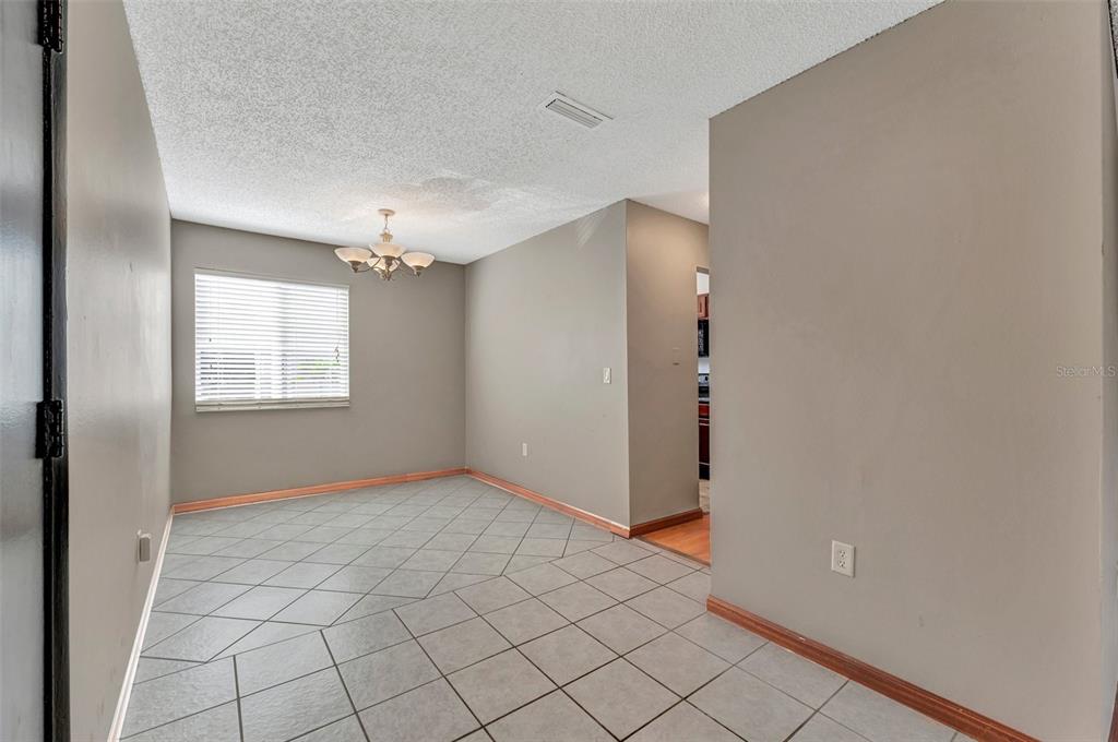 13300 Walsingham Road, Unit 56 Largo, FL 33774 - Photo 9 of 35 a view of an empty room and window