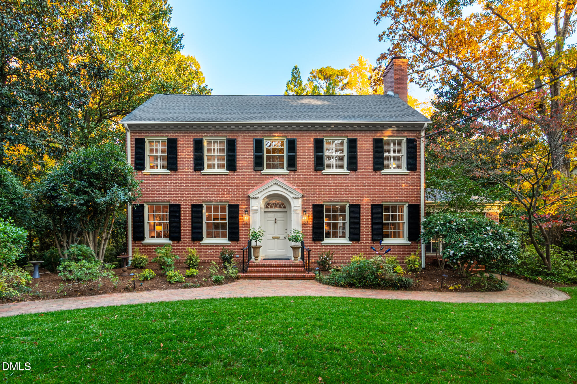 64 Beverly Drive Durham, NC 27707 - Photo 1 of 71 a front view of a house with a garden and plants