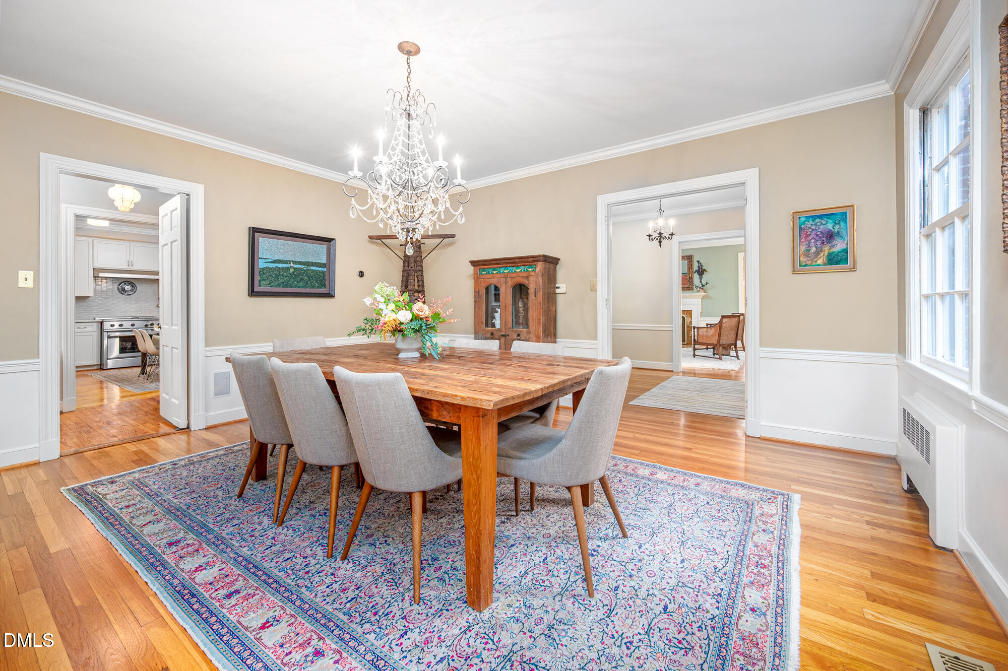 64 Beverly Drive Durham, NC 27707 - Photo 16 of 71 a view of a dining room with furniture wooden floor and chandelier
