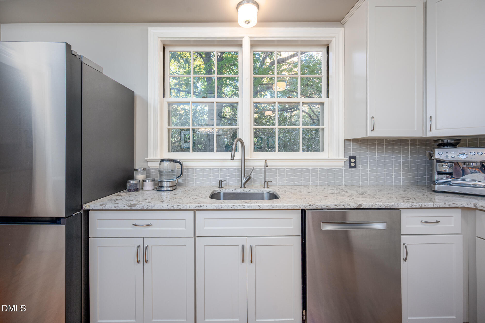 64 Beverly Drive Durham, NC 27707 - Photo 21 of 71 a kitchen with stainless steel appliances granite countertop a sink and a window