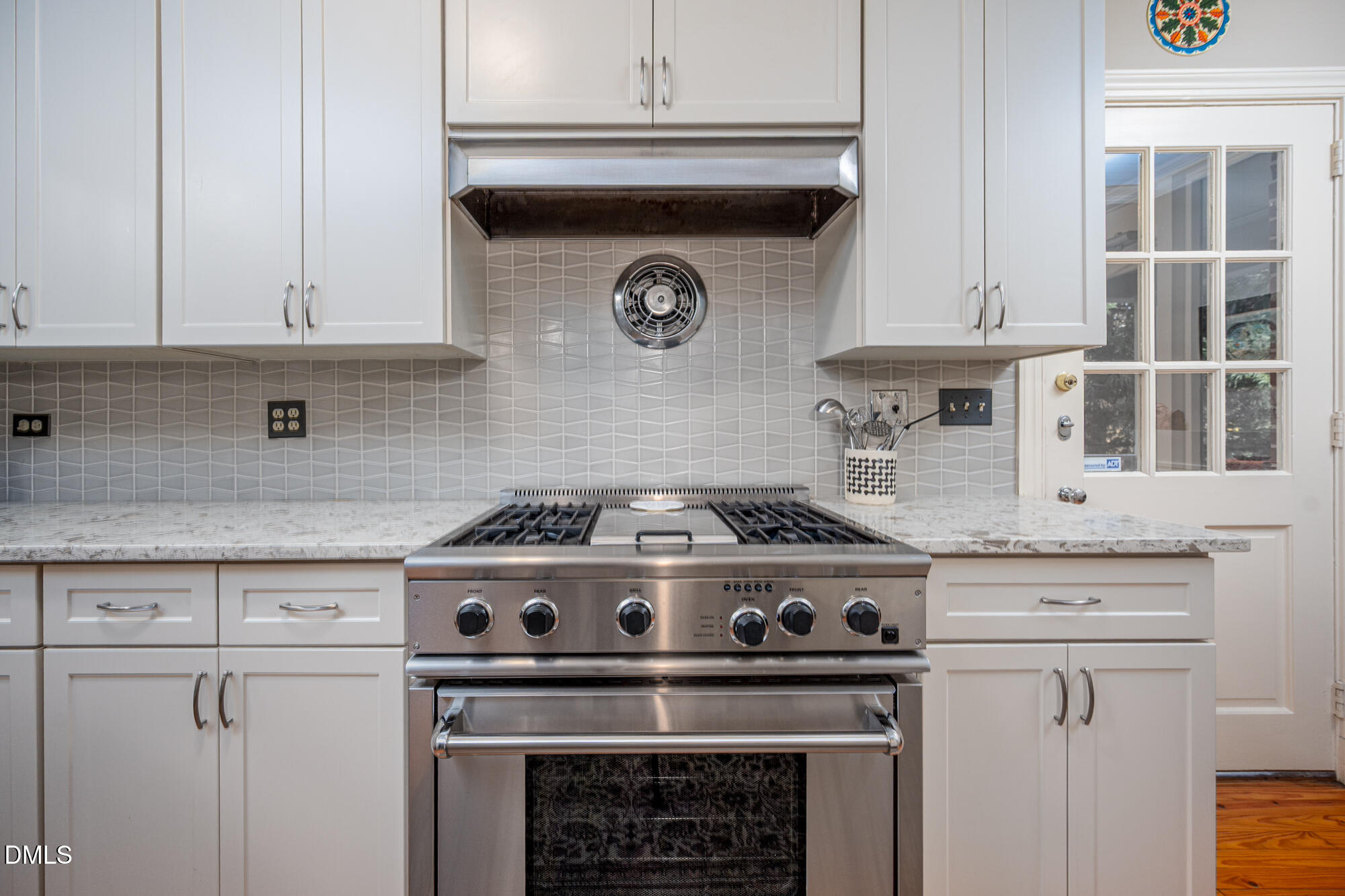 64 Beverly Drive Durham, NC 27707 - Photo 22 of 71 a stove top oven sitting inside of a kitchen