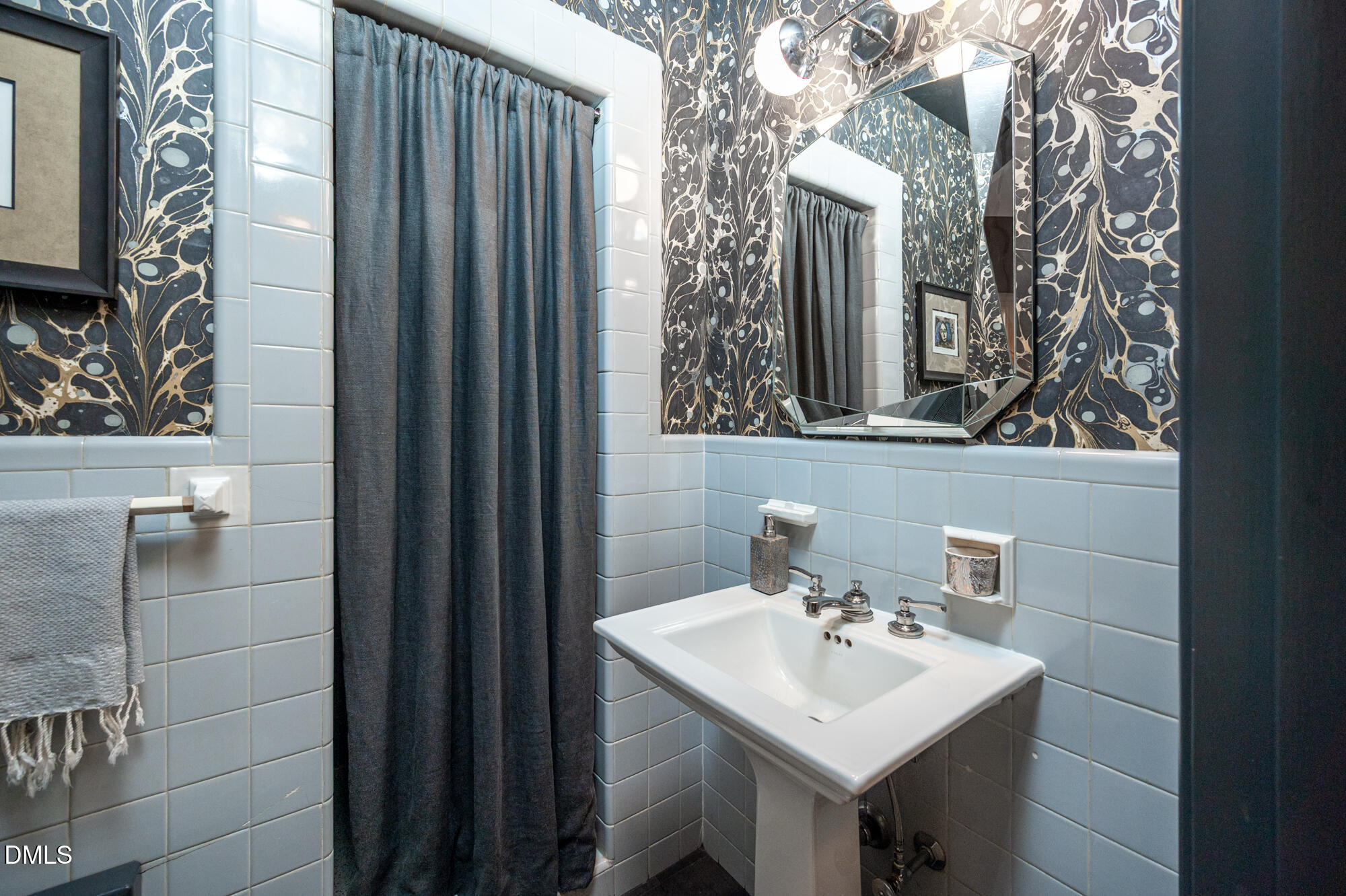 64 Beverly Drive Durham, NC 27707 - Photo 24 of 71 a bathroom with a sink and mirror