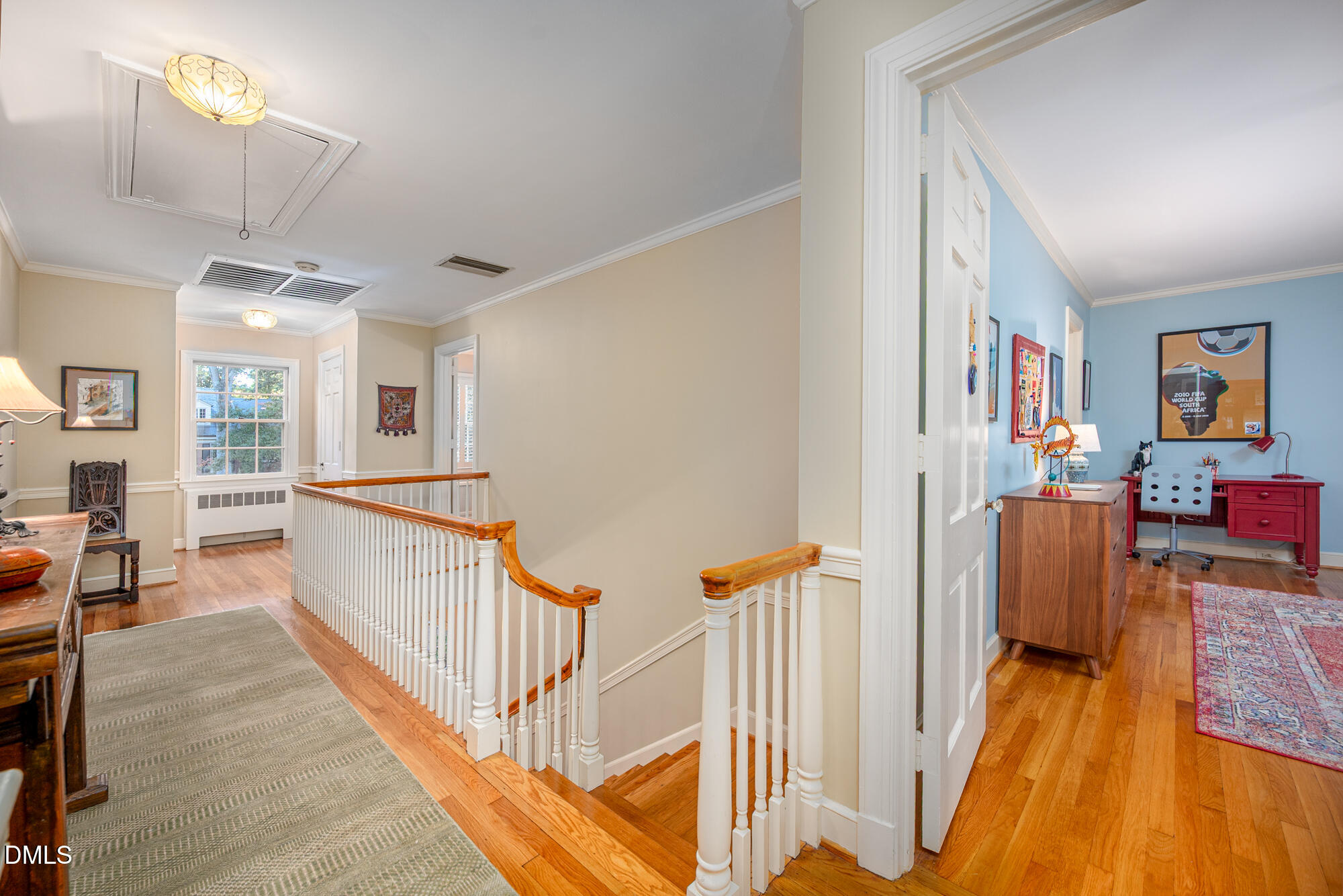 64 Beverly Drive Durham, NC 27707 - Photo 26 of 71 a view of a hallway with wooden floor and furniture