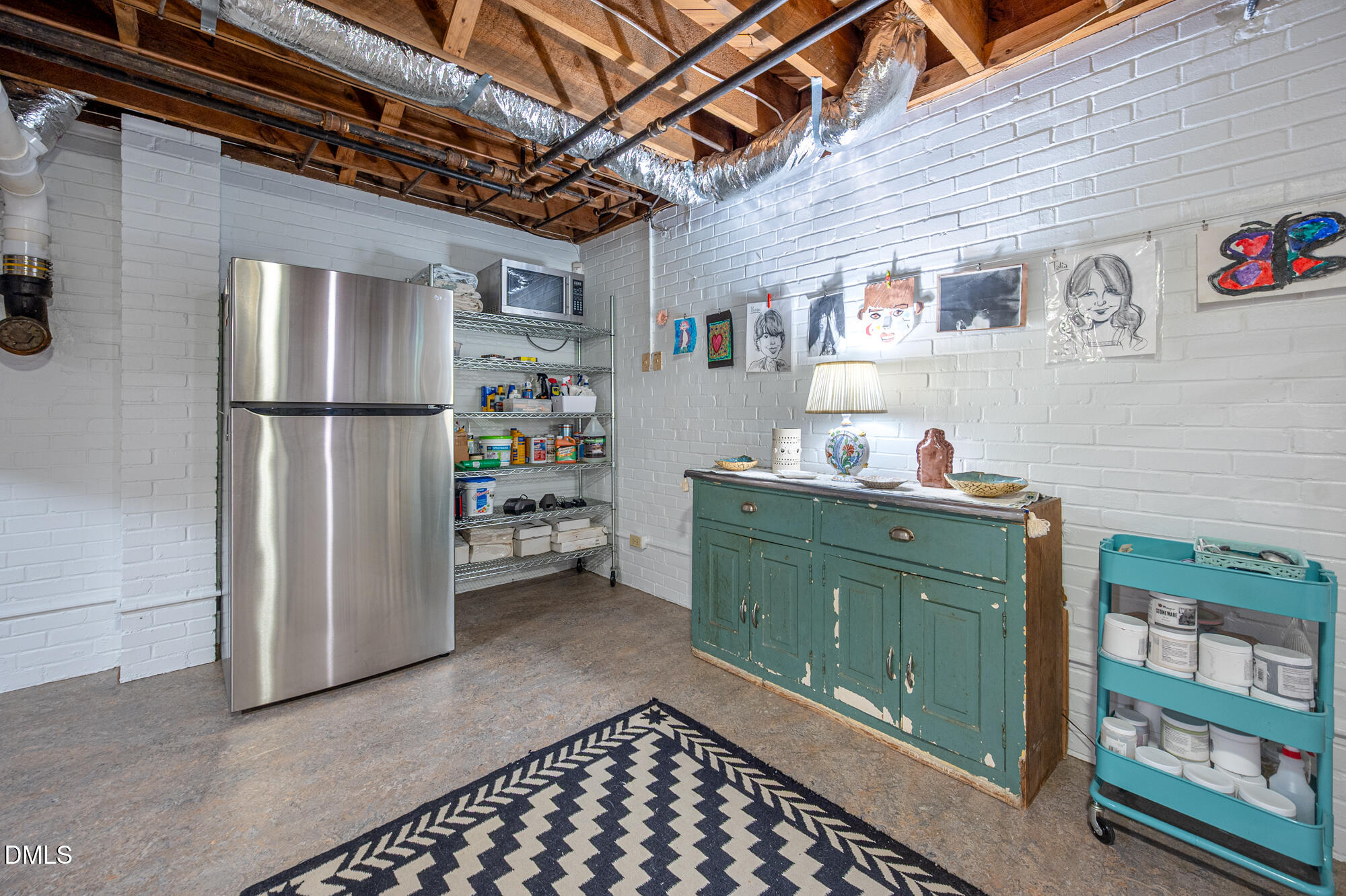 64 Beverly Drive Durham, NC 27707 - Photo 43 of 71 a room with furniture and a refrigerator