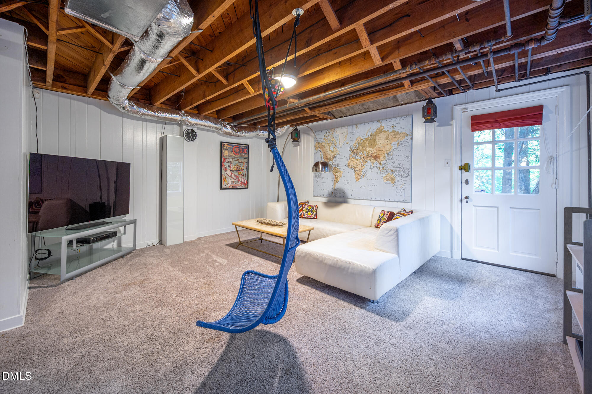 64 Beverly Drive Durham, NC 27707 - Photo 45 of 71 a living room with furniture and a flat screen tv