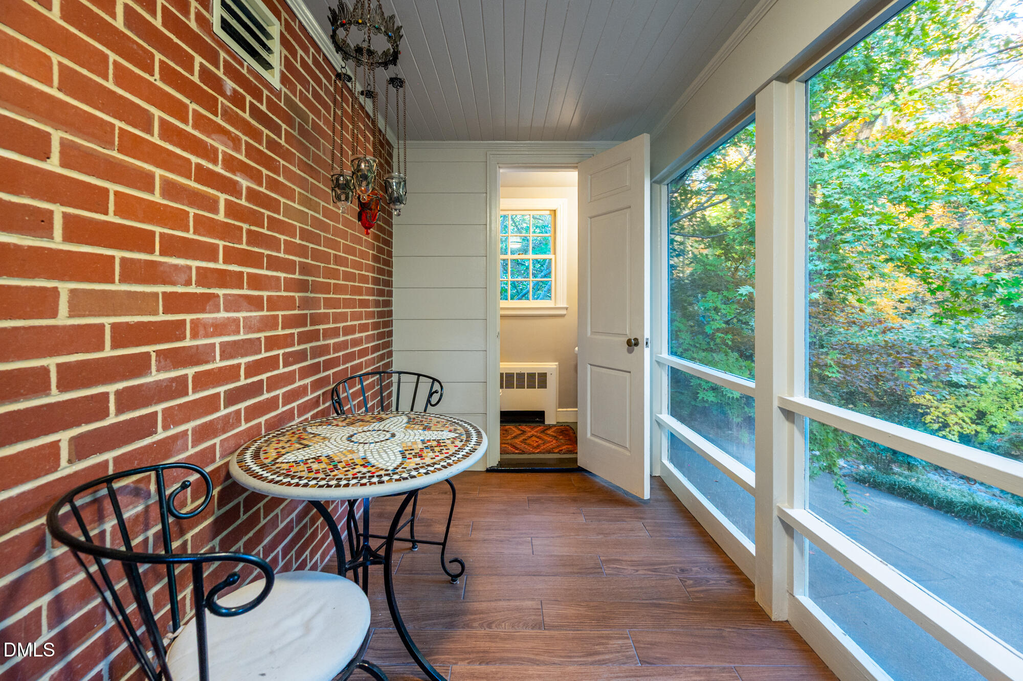 64 Beverly Drive Durham, NC 27707 - Photo 50 of 71 a dining room with furniture and a floor to ceiling window