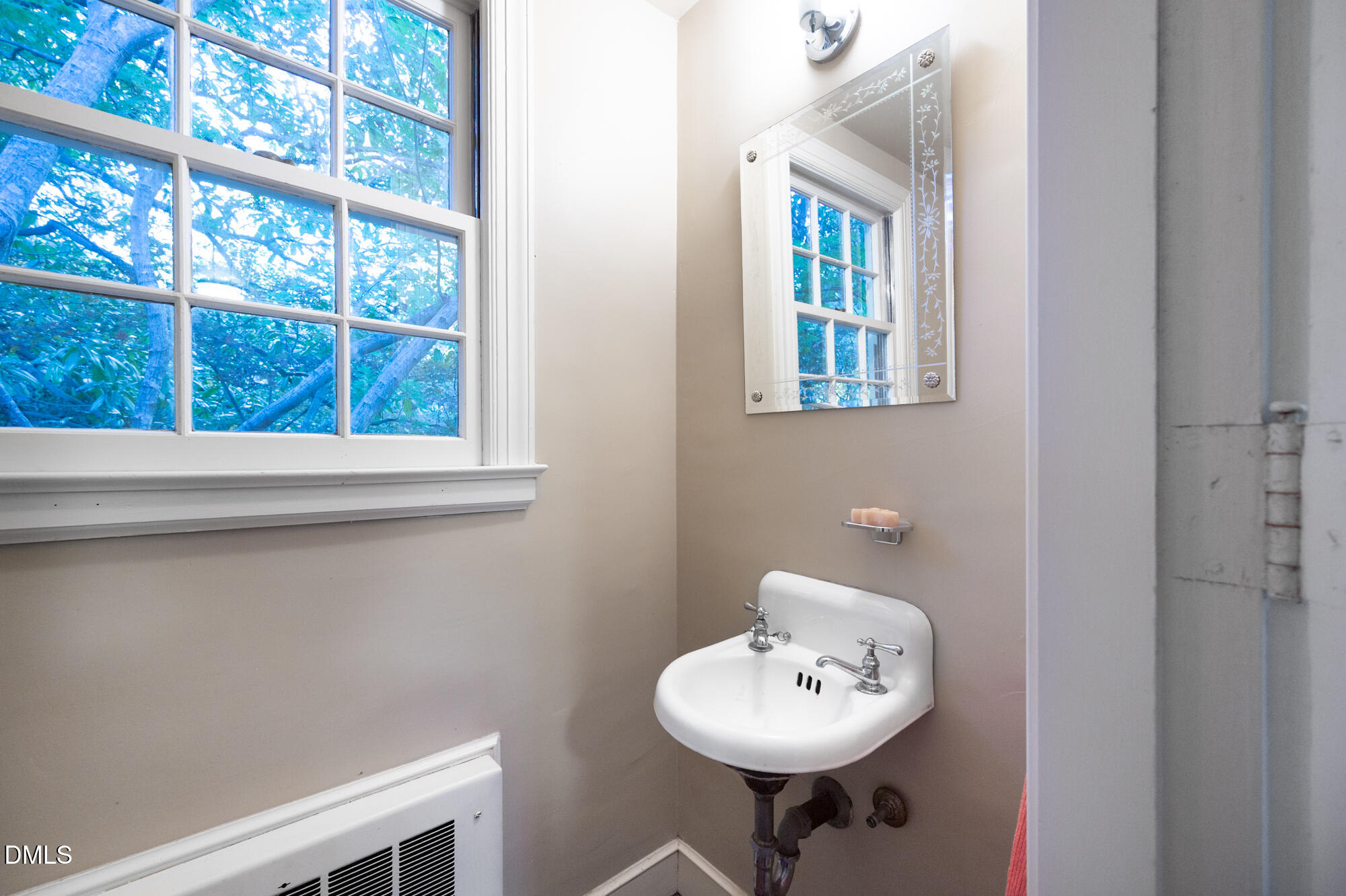 64 Beverly Drive Durham, NC 27707 - Photo 51 of 71 a bathroom with a sink and a window