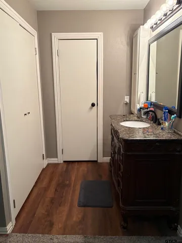 a bathroom with a shower and a sink