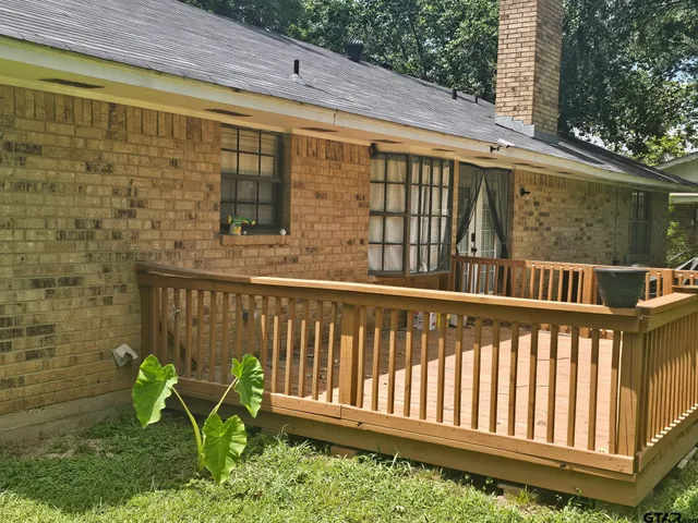 a view of a chair and table in the balcony